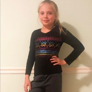 Black Christmas sweater with a rainbow pattern